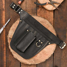 Black leather florist tool belt with secure storage for floral wire, cutters & pruning shears.