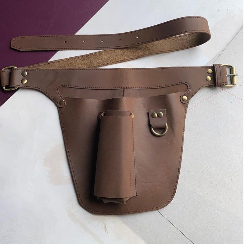 Brown leather gardening tool belt with pockets for trowels, pruning shears & secateurs.