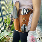 Adjustable leather florist tool belt with deep pockets for pruning shears & floral tools.