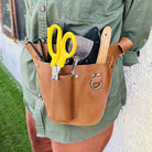 Premium leather gardening tool belt with multiple pockets for secateurs, shears & tools.