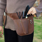 Multi-pocket leather florist tool belt for organizing floral shears, scissors & accessories.